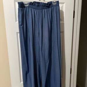 Jean-like. Very cute and flattering. Photo doesn’t do justice. NOT stretchy